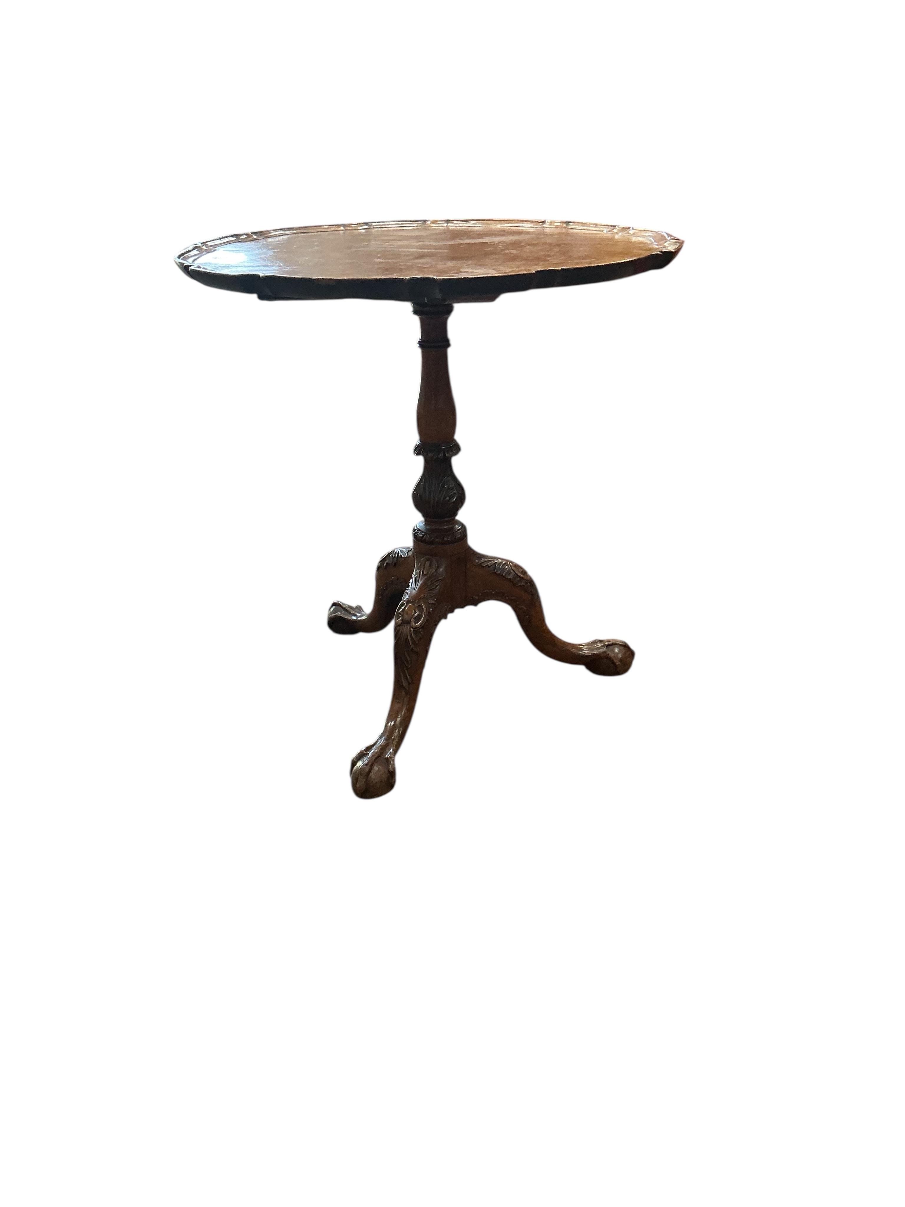 A small George III style circular tilt top mahogany tripod wine table, diameter 54cm, height 59cm
